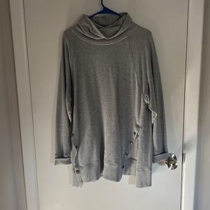 Turtle neck sweater with buttons up both sides